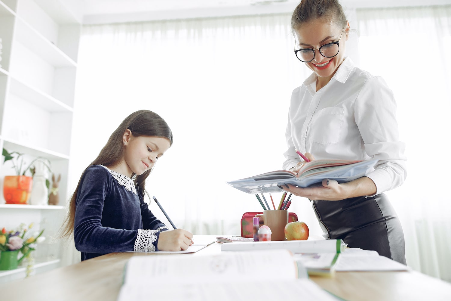 tutor-with-litthe-girl-studying-at-home-